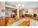 Open concept dining and living area boasts tile floors, fireplace, and natural light at 204 Lake Charles Ct, Oldsmar, FL 34677