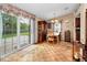 Inviting dining area featuring a china cabinet and sliding glass doors to the backyard at 204 Lake Charles Ct, Oldsmar, FL 34677