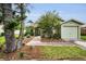 Charming single-story home with a well-manicured lawn and attached one-car garage at 204 Lake Charles Ct, Oldsmar, FL 34677