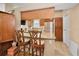 Kitchen bar with wood cabinets, granite countertops, and views of the kitchen appliances at 204 Lake Charles Ct, Oldsmar, FL 34677
