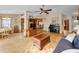 Open concept living and dining area with wood floors, and natural light at 204 Lake Charles Ct, Oldsmar, FL 34677