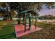 Community picnic area with shaded tables and grills with lake view for residents to enjoy at 204 Lake Charles Ct, Oldsmar, FL 34677