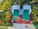 Aerial view of the community's racquetball courts surrounded by mature landscaping at 204 Lake Charles Ct, Oldsmar, FL 34677