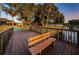 A scenic park showcasing a wooden dock, lakeside walking path, and lush landscaping at 204 Lake Charles Ct, Oldsmar, FL 34677