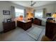Bedroom featuring carpet, a ceiling fan, and natural light from two windows at 2195 Academy Dr, Clearwater, FL 33764