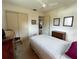 Bedroom featuring carpet, a ceiling fan, and a closet with sliding doors at 2195 Academy Dr, Clearwater, FL 33764