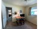 Bedroom featuring carpet, natural light from a window, and workspace at 2195 Academy Dr, Clearwater, FL 33764