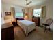 Bedroom featuring carpet, a ceiling fan, natural light and classic furnishings at 2195 Academy Dr, Clearwater, FL 33764