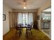 Classic dining room with seating for four and natural light, adjacent to the kitchen at 2195 Academy Dr, Clearwater, FL 33764