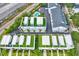 An aerial view highlights the townhomes with rooftop terraces and a community pool at 2442 W Mississippi Ave # 5, Tampa, FL 33629