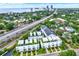 An aerial view showcases the townhomes with rooftop terraces and proximity to the city and bay at 2442 W Mississippi Ave # 5, Tampa, FL 33629
