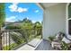 Outdoor balcony with seating area overlooking landscaped surroundings at 2442 W Mississippi Ave # 5, Tampa, FL 33629