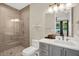 Modern bathroom featuring a glass-enclosed shower, stylish vanity, and tiled flooring at 2442 W Mississippi Ave # 5, Tampa, FL 33629