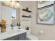 Stylish half bathroom featuring modern fixtures and decor at 2442 W Mississippi Ave # 5, Tampa, FL 33629