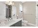 Well-lit bathroom featuring gray vanity and shower at 2442 W Mississippi Ave # 5, Tampa, FL 33629