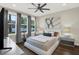 Serene bedroom with large windows, stylish decor, and a comfortable platform bed at 2442 W Mississippi Ave # 5, Tampa, FL 33629