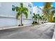A row of townhomes features private garages and landscaping at 2442 W Mississippi Ave # 5, Tampa, FL 33629