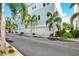 A row of townhomes features private garages and landscaping at 2442 W Mississippi Ave # 5, Tampa, FL 33629