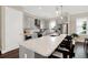Bright, open kitchen featuring an island with seating, stainless appliances, and pendant lighting at 2442 W Mississippi Ave # 5, Tampa, FL 33629