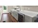 Well-appointed kitchenette with gray cabinets and wine cooler at 2442 W Mississippi Ave # 5, Tampa, FL 33629