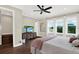 Main bedroom features hardwood floors, ceiling fan and three bright windows at 2442 W Mississippi Ave # 5, Tampa, FL 33629