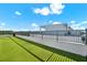 Spacious rooftop deck with artificial grass and metal railing at 2442 W Mississippi Ave # 5, Tampa, FL 33629