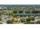 Aerial view of the community with a pond behind the property at 2510 Laurelwood Dr # 5B, Clearwater, FL 33763