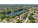 Aerial view showcasing the community's layout, nestled beside a serene lake and lush green landscapes at 2510 Laurelwood Dr # 5B, Clearwater, FL 33763
