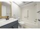 Bathroom featuring a tub, shower, white tiles, and a vanity with modern fixtures at 2510 Laurelwood Dr # 5B, Clearwater, FL 33763
