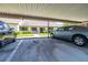 Assigned carport parking, showing two cars parked under the covered structure for protection at 2510 Laurelwood Dr # 5B, Clearwater, FL 33763