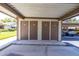 Carport storage unit featuring numbered doors and ample space for storing belongings and equipment at 2510 Laurelwood Dr # 5B, Clearwater, FL 33763