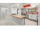 Bright kitchen with stainless steel appliances and breakfast bar at 2510 Laurelwood Dr # 5B, Clearwater, FL 33763