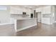 Beautiful kitchen with a large island, stainless steel appliances, and modern finishes at 2603 Wise River Ln, Zephyrhills, FL 33541