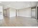 Spacious living room boasts wood-look tile flooring and a tray ceiling at 2603 Wise River Ln, Zephyrhills, FL 33541