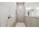 Tiled shower with a built-in niche and modern fixtures at 2603 Wise River Ln, Zephyrhills, FL 33541