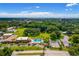 Overhead aerial view of the community pool and lush landscaping at 2928 Feather Dr, Clearwater, FL 33759