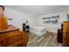 Bedroom featuring light walls, matching floors, and a window adding to the home's natural light at 2928 Feather Dr, Clearwater, FL 33759