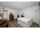 Spacious bedroom with plenty of natural light, neutral decor, and wood-look flooring, ready for personalization at 2928 Feather Dr, Clearwater, FL 33759