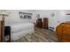 Neutral bedroom with a large window, wood-look floors, and tasteful furniture complementing the space at 2928 Feather Dr, Clearwater, FL 33759