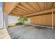 Spacious carport area with support beams and beige structure at 2928 Feather Dr, Clearwater, FL 33759