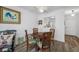 Cozy dining area with a round table and comfortable seating near the pass-through to the kitchen at 2928 Feather Dr, Clearwater, FL 33759