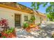 Close up of townhome with cozy bench and colorful garden at 2928 Feather Dr, Clearwater, FL 33759