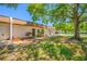 Charming single-story home featuring a cozy front porch and well-maintained landscaping, shaded by mature trees at 2928 Feather Dr, Clearwater, FL 33759