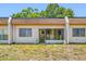 A full view of the back of the property featuring windows and a door at 2928 Feather Dr, Clearwater, FL 33759