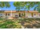 Charming townhome featuring a well-maintained lawn and cozy front porch seating at 2928 Feather Dr, Clearwater, FL 33759