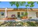 Charming townhome with a cozy front porch, garden bed, and a well-maintained yard at 2928 Feather Dr, Clearwater, FL 33759