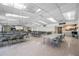 Spacious hall with tables, chairs, and ample natural light, perfect for gatherings and events at 2928 Feather Dr, Clearwater, FL 33759