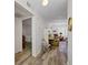 Hallway with wood-look flooring leads to the bedroom and living room at 2928 Feather Dr, Clearwater, FL 33759