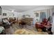 Bright and spacious living room with comfortable seating, seamlessly connects to dining area at 2928 Feather Dr, Clearwater, FL 33759