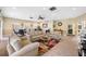 Inviting lounge featuring couches, tables, a ceiling fan, and tile flooring throughout at 2928 Feather Dr, Clearwater, FL 33759